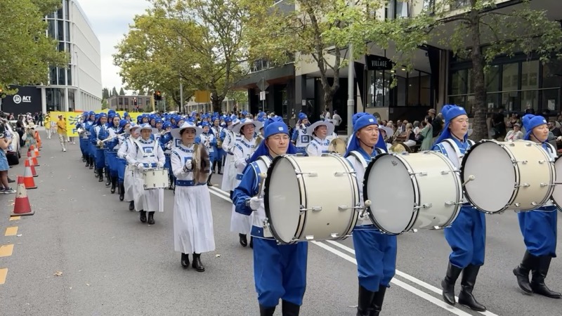 Drumline in blue and white uniforms at the Canberra Multicultural Festival